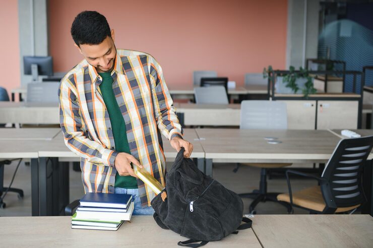 handsome-young-indian-boy-student-with-books-backpack-university-education-concept_255667-44406